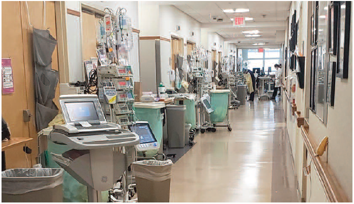 Figure 1. Pumps lined up outside patient rooms in a hospital ICU (March 2020).
